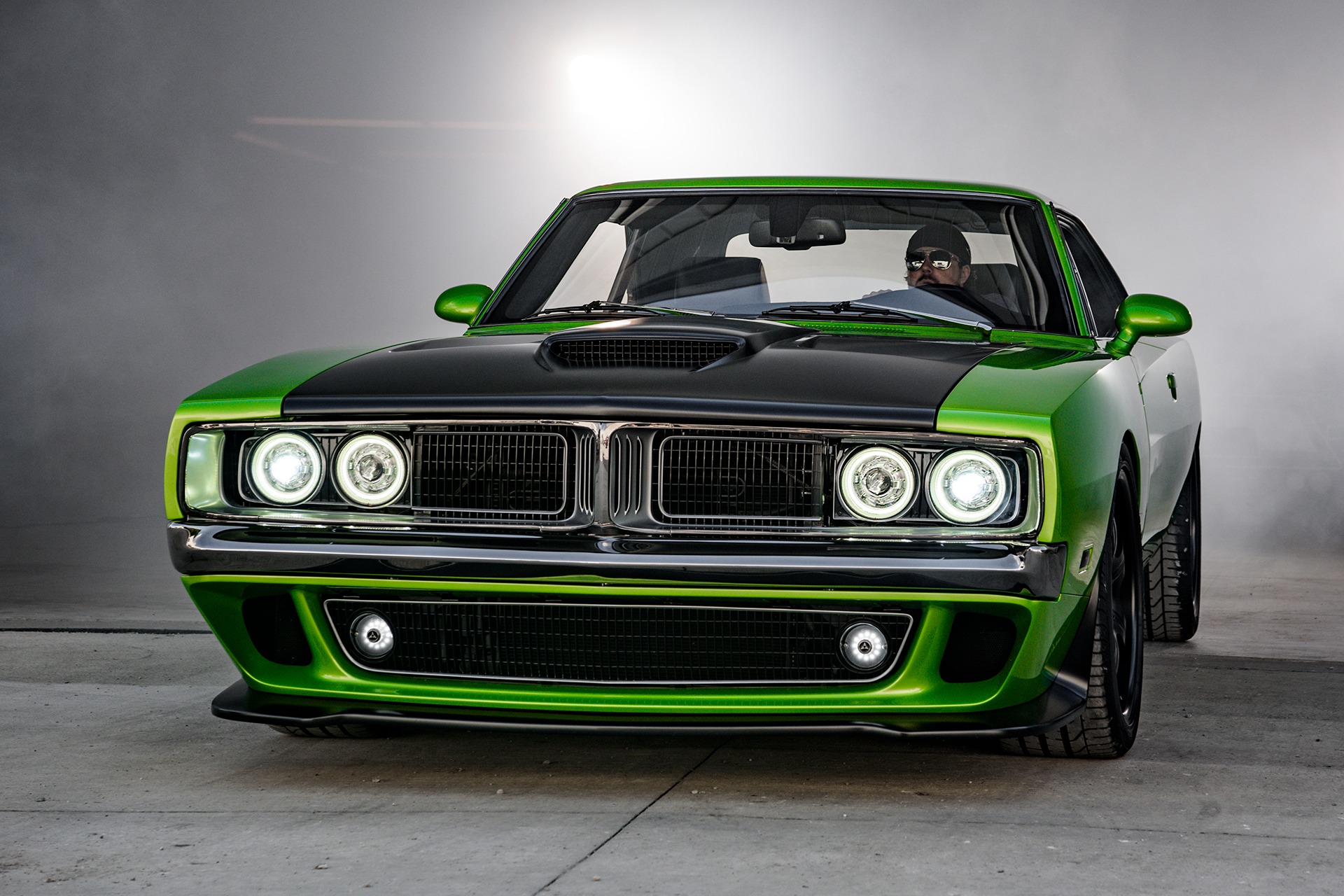 Green custom muscle car photographed in a clean studio